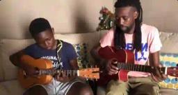 WATCH: Tuku's Grandson Playing The Guitar